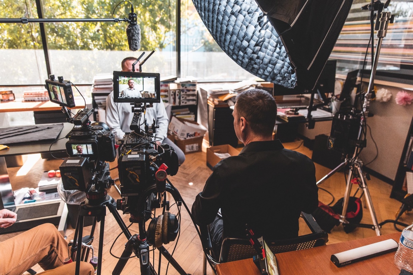 Film crew shooting the EPI documentary in an office