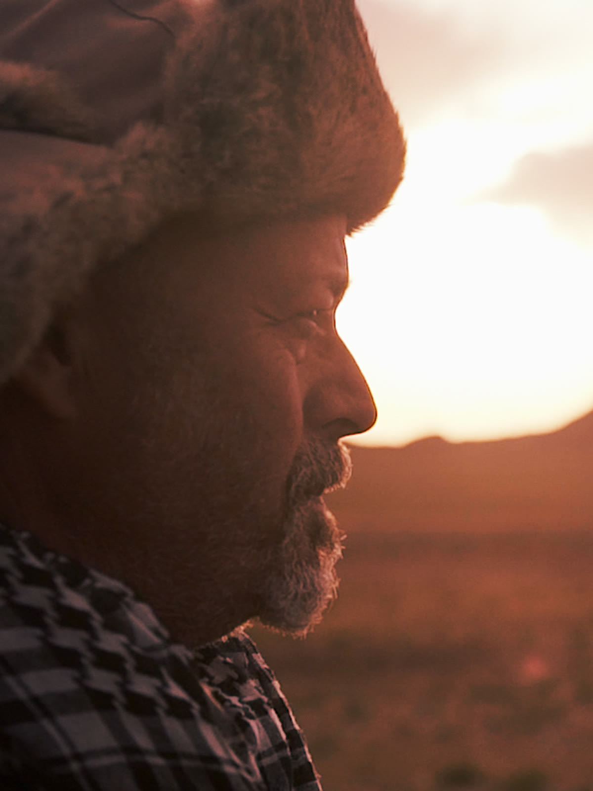 Mike Axelrad in a fur hat at sunset