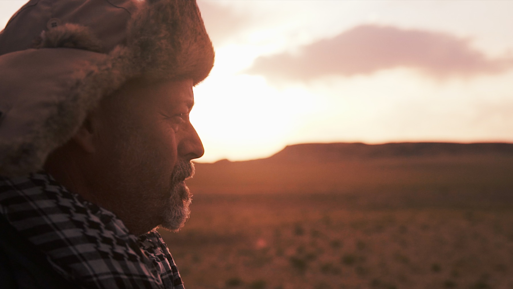 Mike Axelrad at sunset on the Mongolian steppe, from Minii Ayam